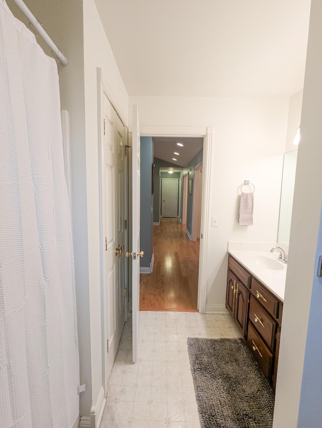 781 E Lexington St, Harrodsburg, KY 40330 - bathroom with vanity, baseboards, tile patterned floors, and curtained shower