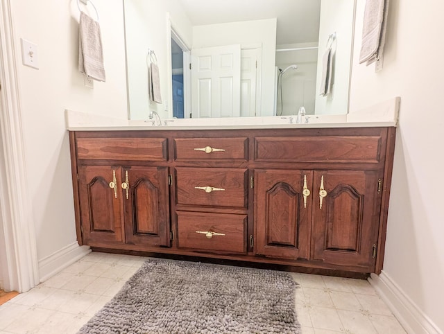 781 E Lexington St, Harrodsburg, KY 40330 - full bathroom with double vanity, baseboards, and a shower