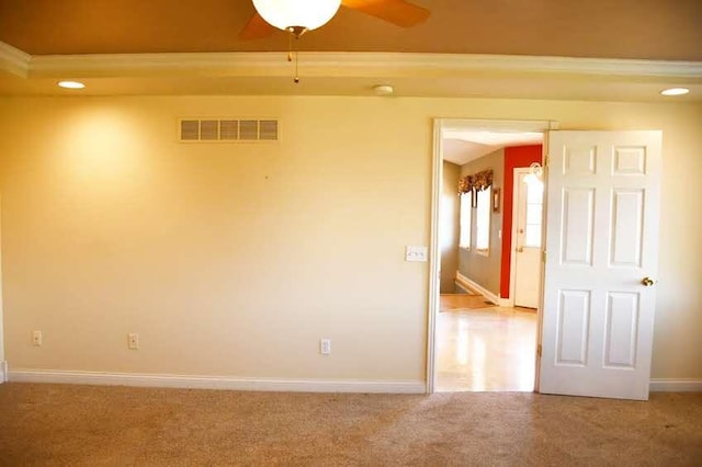 empty room featuring carpet floors and ceiling fan