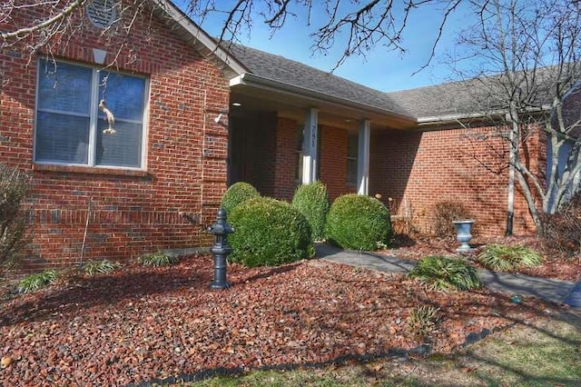 781 E Lexington St, Harrodsburg, KY 40330 - view of side of property featuring brick siding and a shingled roof
