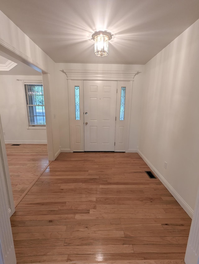 781 E Lexington St, Harrodsburg, KY 40330 - entryway with light wood-type flooring and baseboards