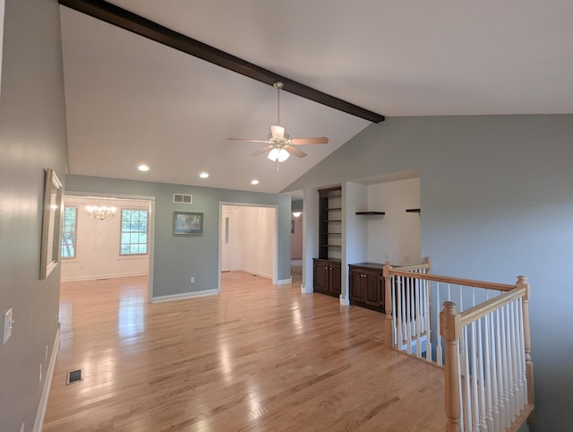 781 E Lexington St, Harrodsburg, KY 40330 - empty room with a chandelier, ceiling fan, light wood-style flooring, baseboards, and built in features