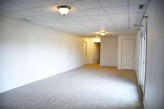 spare room featuring light colored carpet