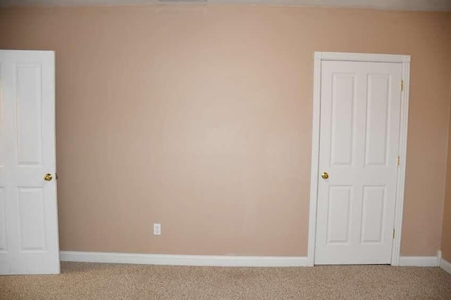 unfurnished room with carpet floors