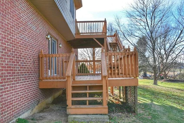 wooden deck featuring a lawn