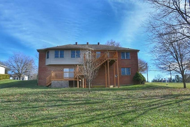 rear view of house featuring a yard and a wooden deck