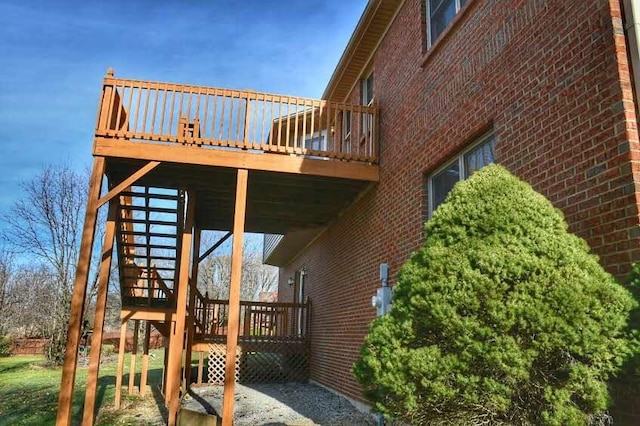 view of home's exterior featuring a wooden deck