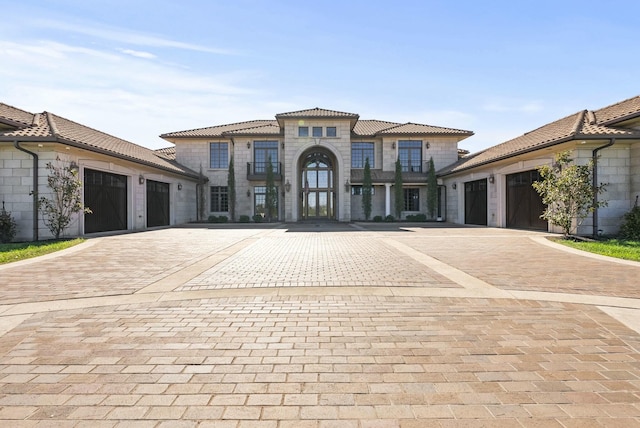 mediterranean / spanish house featuring a garage