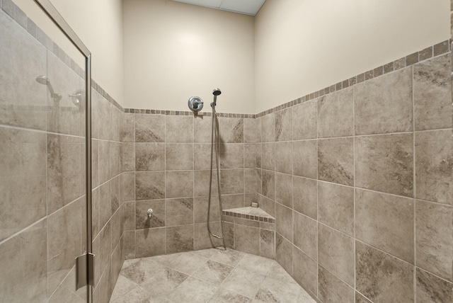 bathroom with a tile shower