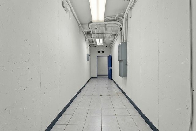 hall featuring light tile patterned floors