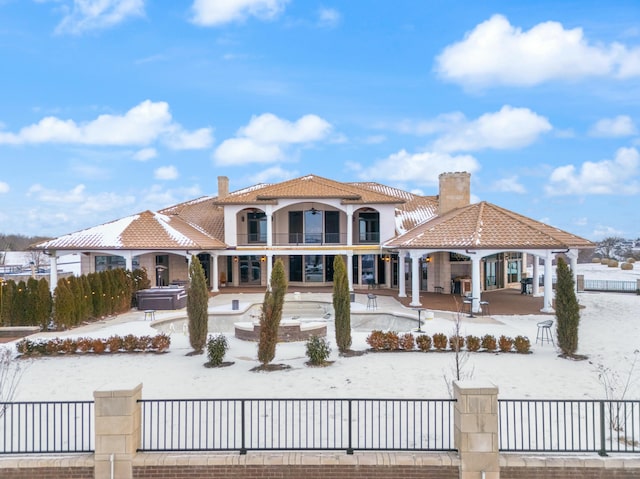 exterior space featuring a hot tub