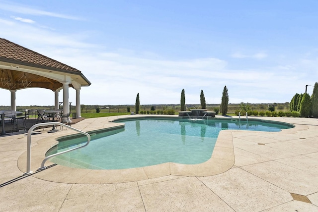 view of swimming pool featuring a patio and pool water feature