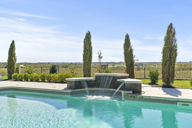 view of pool with pool water feature and a jacuzzi