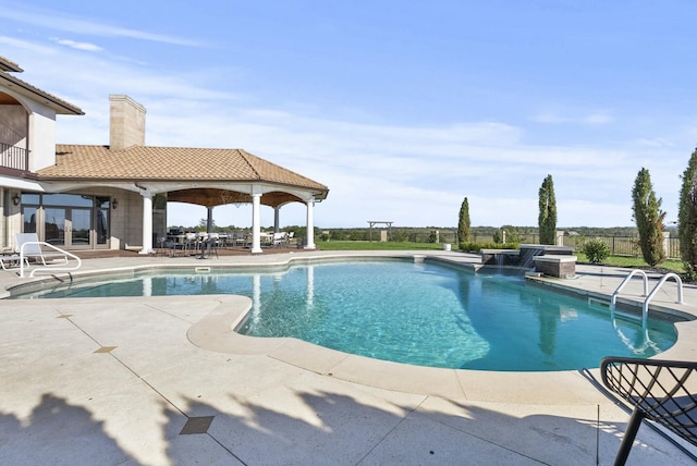 view of swimming pool featuring a patio area