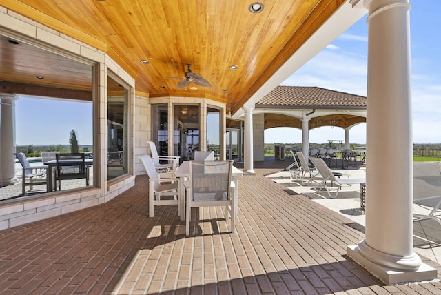 view of patio / terrace featuring ceiling fan