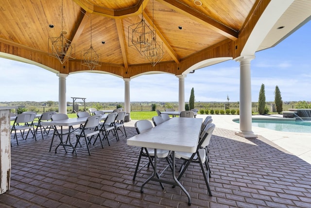 view of patio / terrace featuring a fenced in pool and pool water feature