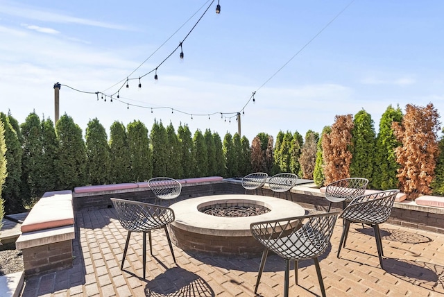 view of patio / terrace featuring a fire pit