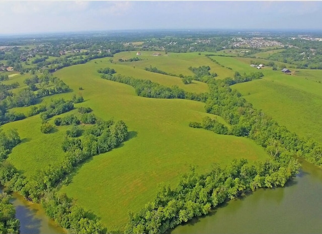 bird's eye view with a water view and a rural view