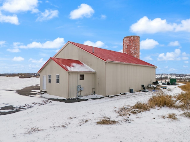 view of snow covered house