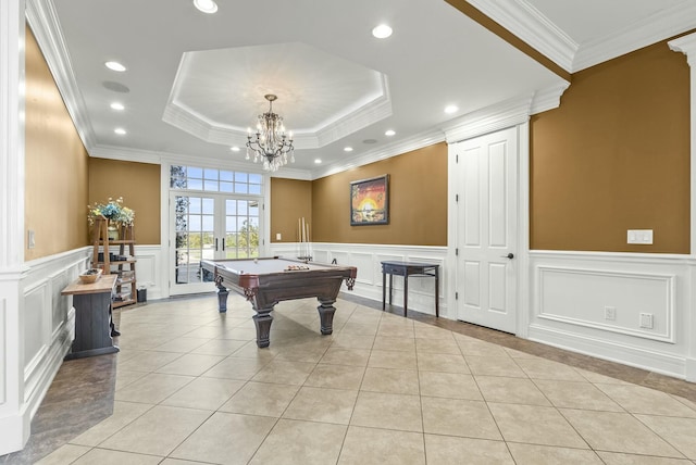 rec room featuring crown molding, a tray ceiling, pool table, and light tile patterned flooring