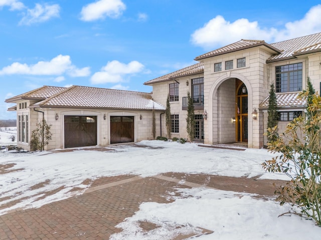 mediterranean / spanish-style house featuring a garage