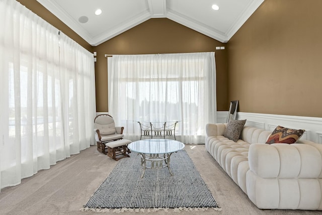 living room with ornamental molding, vaulted ceiling, and light carpet