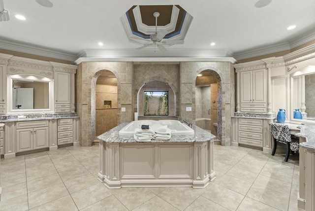 interior space featuring crown molding, a kitchen island, and cream cabinetry