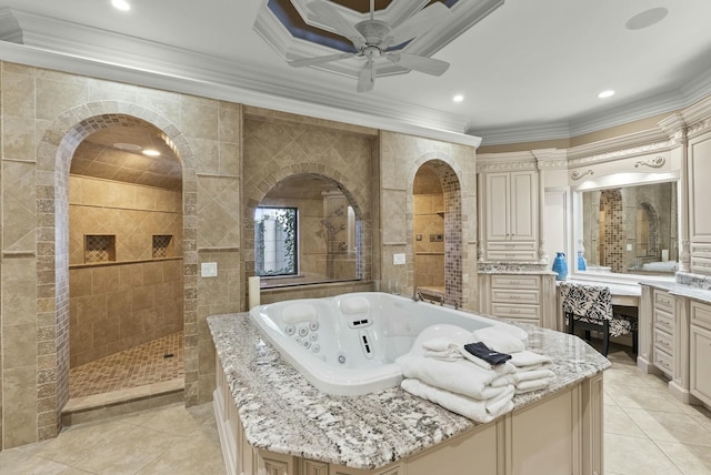 bathroom with crown molding, tile patterned flooring, tile walls, vanity, and independent shower and bath