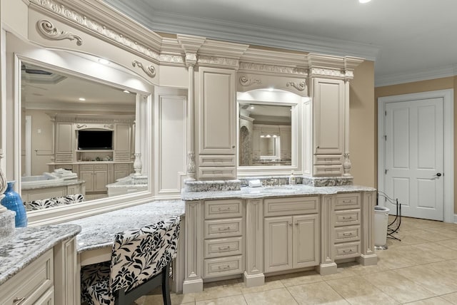 bathroom with crown molding, vanity, and tile patterned flooring