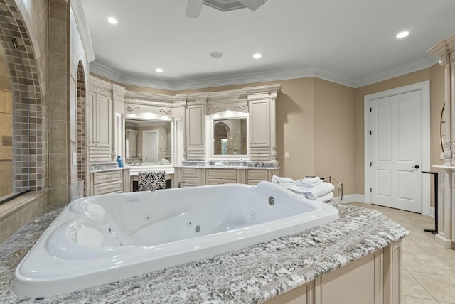 bathroom with vanity, tile patterned flooring, ornamental molding, and a bathing tub