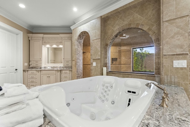 bathroom with crown molding, a bathing tub, and vanity