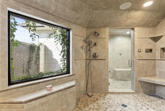 bathroom with a tile shower