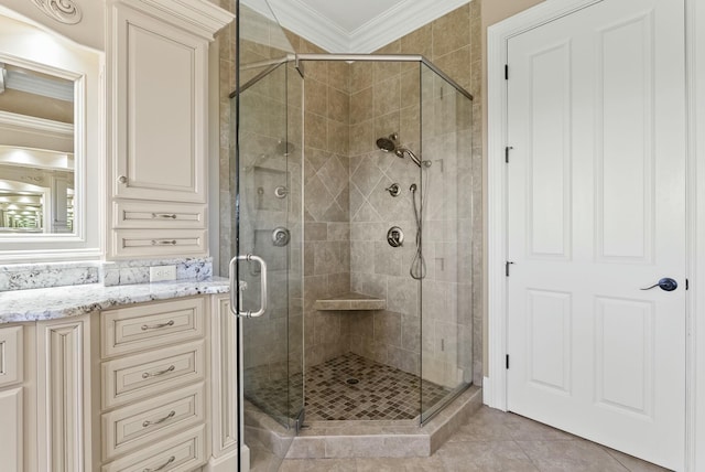 bathroom with crown molding, tile patterned flooring, and a shower with door