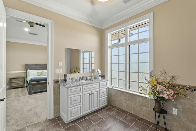 bathroom with tile patterned flooring, vanity, ceiling fan, and crown molding