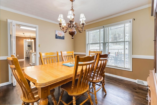 dining area with an inviting chandelier, crown molding, and dark wood-type flooring