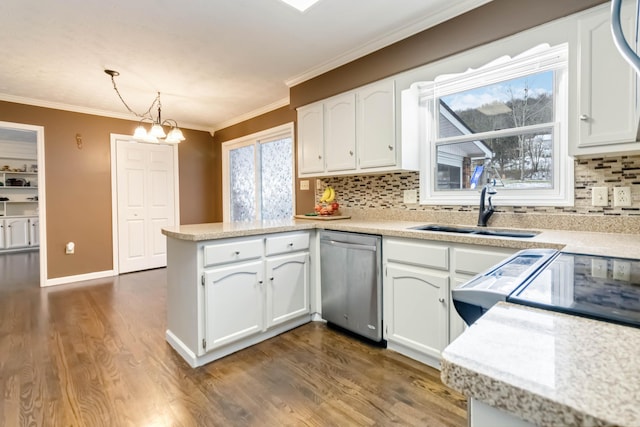 kitchen featuring dishwasher, white cabinets, sink, decorative light fixtures, and kitchen peninsula