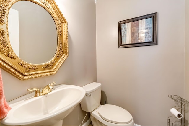 bathroom featuring toilet and sink