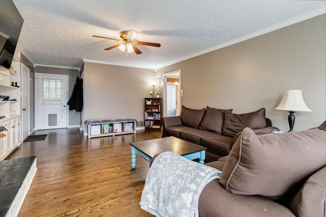 living room with crown molding, light hardwood / wood-style floors, ceiling fan, and a textured ceiling