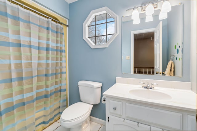 bathroom featuring tile patterned flooring, vanity, a shower with shower curtain, and toilet