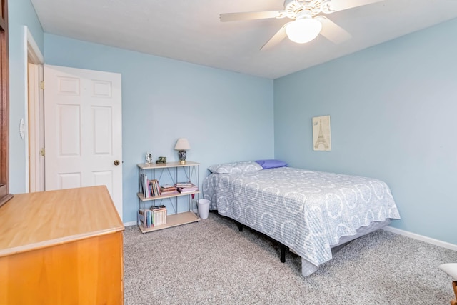 bedroom featuring ceiling fan and carpet