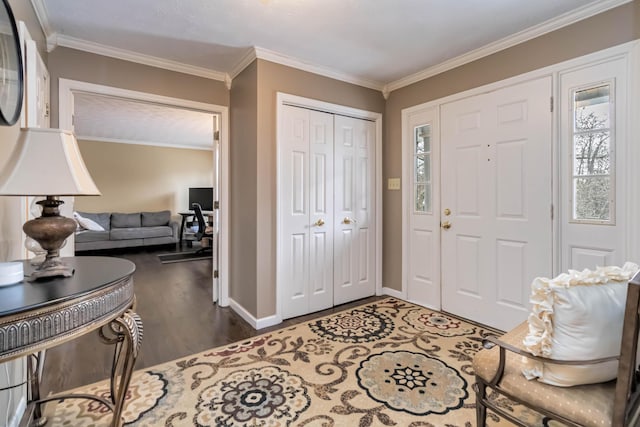 foyer entrance featuring dark wood-type flooring and ornamental molding