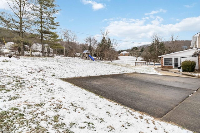 view of yard covered in snow