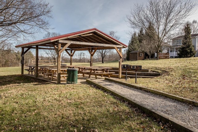 view of home's community featuring a storage unit and a lawn