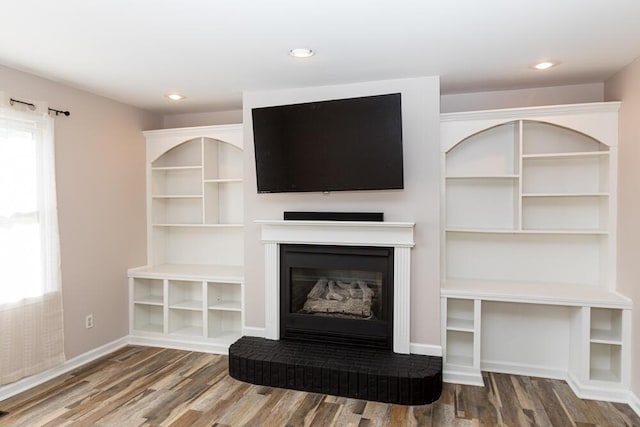 unfurnished living room with hardwood / wood-style floors