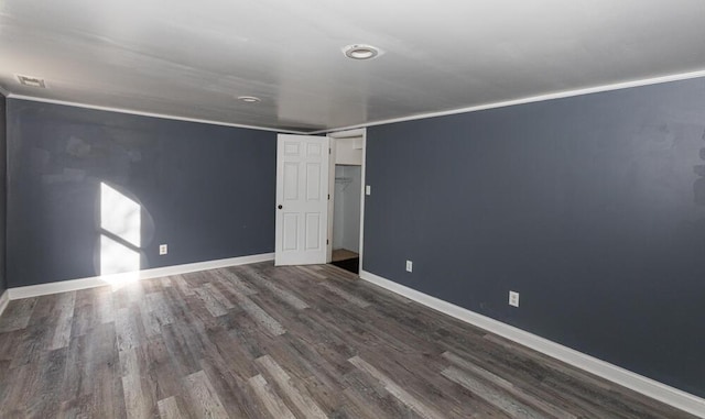 unfurnished bedroom with dark hardwood / wood-style flooring