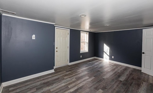 spare room featuring dark hardwood / wood-style flooring