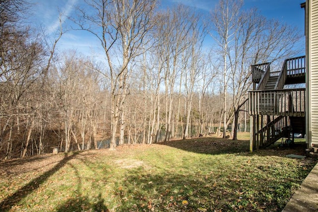 view of yard with a wooden deck