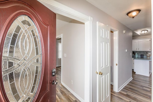 hallway with hardwood / wood-style floors