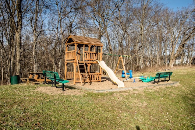 view of jungle gym with a lawn