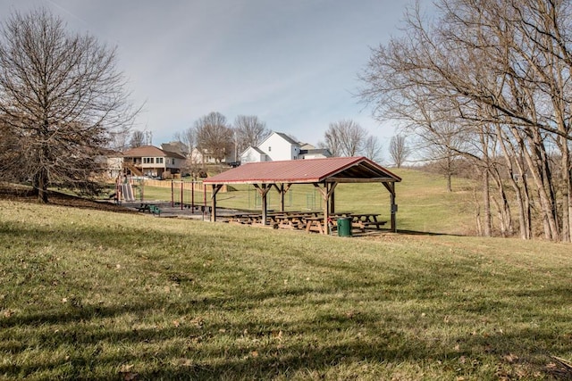 view of property's community with a gazebo and a lawn